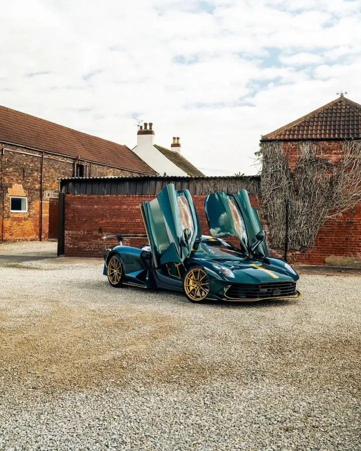 Performance car displayed in a courtyard