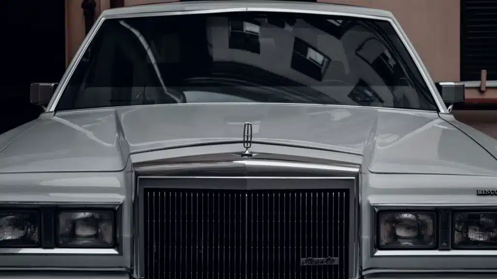 Front view of a classic Lincoln Continental Mark V in silver, showcasing vintage style and elegance.