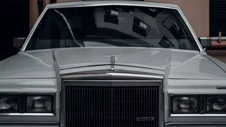Front view of a classic Lincoln Continental Mark V in silver, showcasing vintage style and elegance.