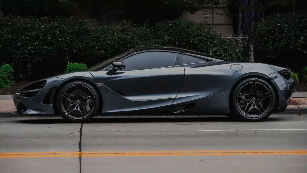Elegant sports car with modern design parked on a city street, showcasing luxury and style.