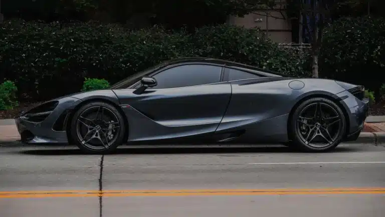 Elegant sports car with modern design parked on a city street, showcasing luxury and style.